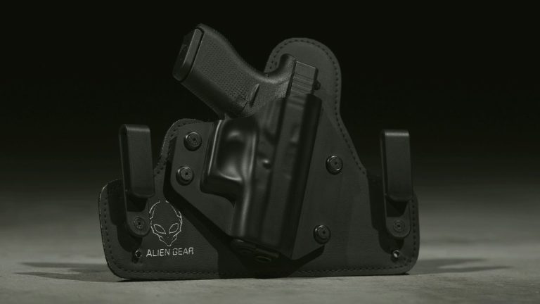 Black semi-auto pistol on a wooden counter